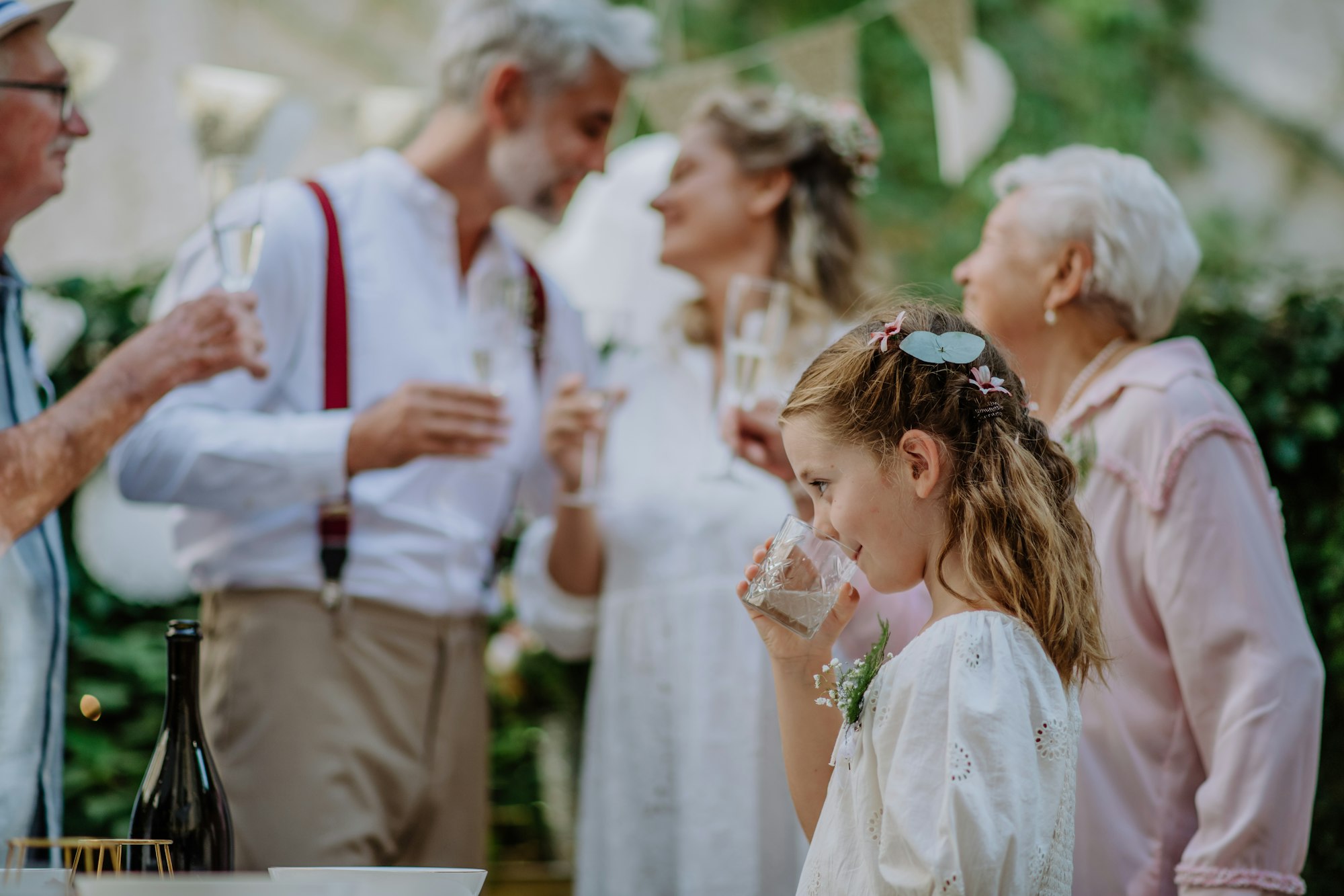 Multigenerational family at the outdoor wedding party.